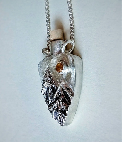 Fantasy inspired tiny corked sterling silver potion bottle featuring mountains and a sparkling Citrine sun.
